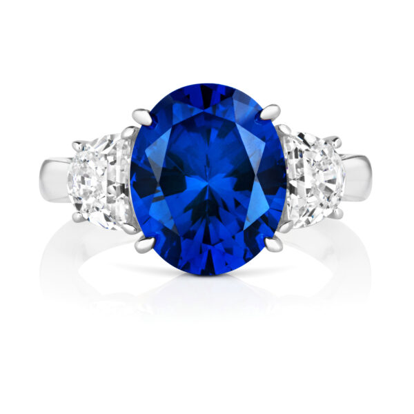 Sterling Silver Blue Oval Centre Stone Claw Set With Half Moon Sides Trilogy Ring - Image 2