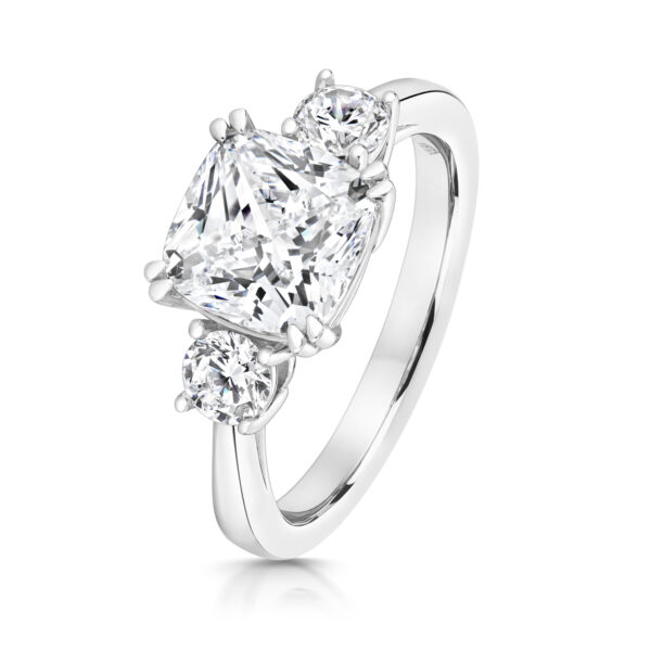 Sterling Silver Cushion Centre Stone Double Claw Set With Round Sides Trilogy Ring