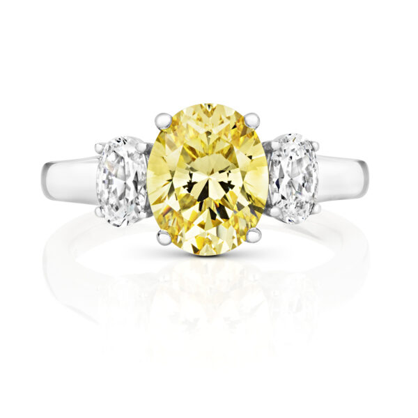 Sterling Silver Oval Centre Yellow Stone Claw Set With Oval Sides Trilogy Ring