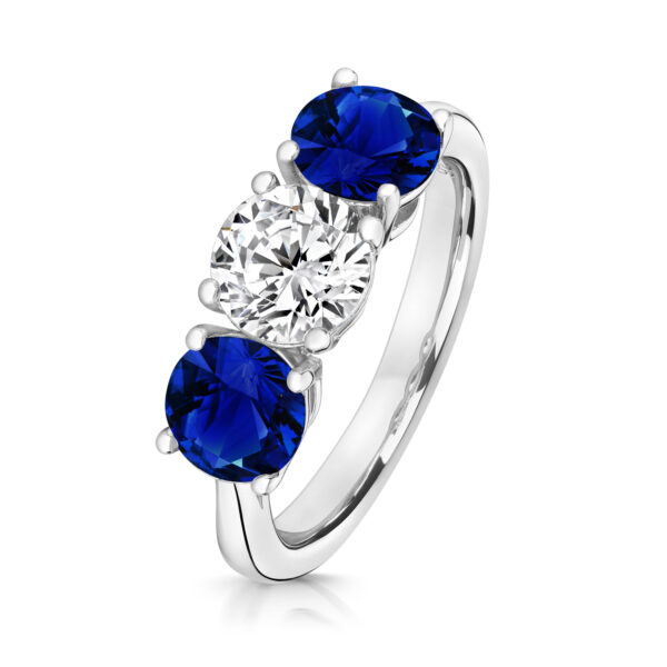 Sterling Silver Round Centre Stone Claw Set With Blue Round Sides Trilogy Ring - Image 2