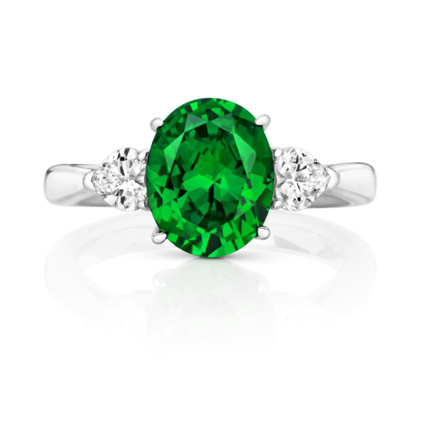 GREEN OVAL CENTRE STONE CLAW SET WITH HEART SHAPE SIDES TRILOGY RING - Image 2
