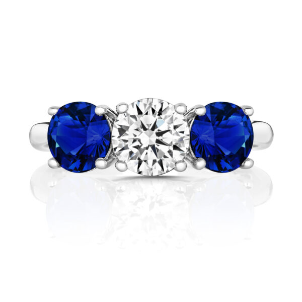 Sterling Silver Round Centre Stone Claw Set With Blue Round Sides Trilogy Ring - Image 2