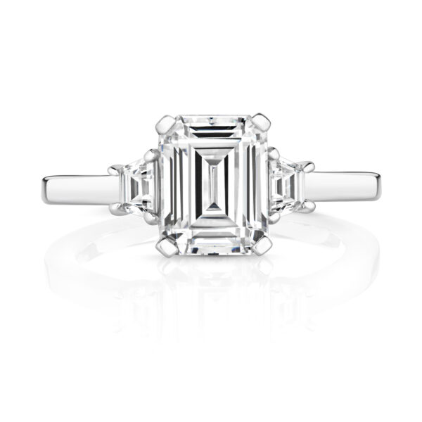 Sterling Silver Emerald Cut Centre Stone Claw Set With Trapezium Sides Trilogy Ring - Image 2