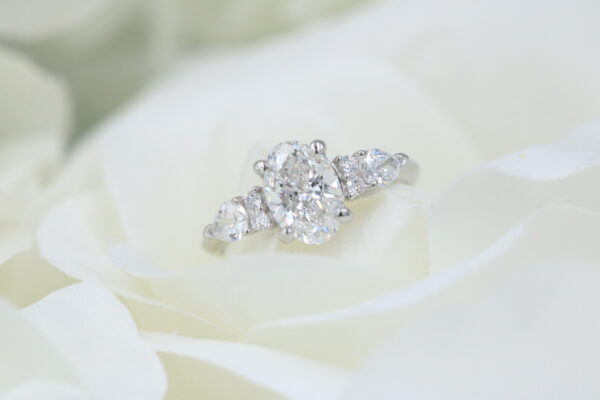Platinum 1.51ct Oval D/VVS2 0.54ct Pear/Brilliant Sides